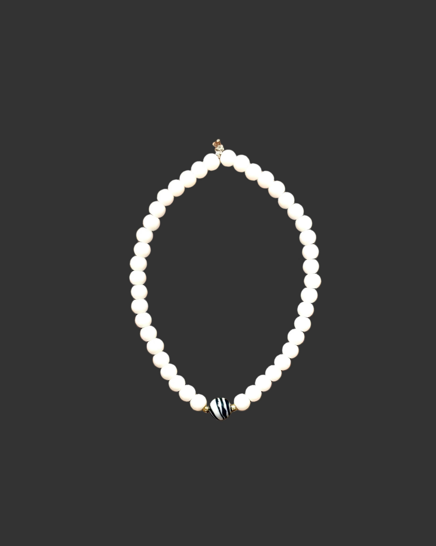 022 - White Seed Bead Bracelet with Zebra Accent