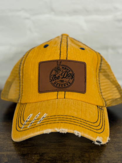 "Have the Day You Deserve" Leather Patch Distressed Hat