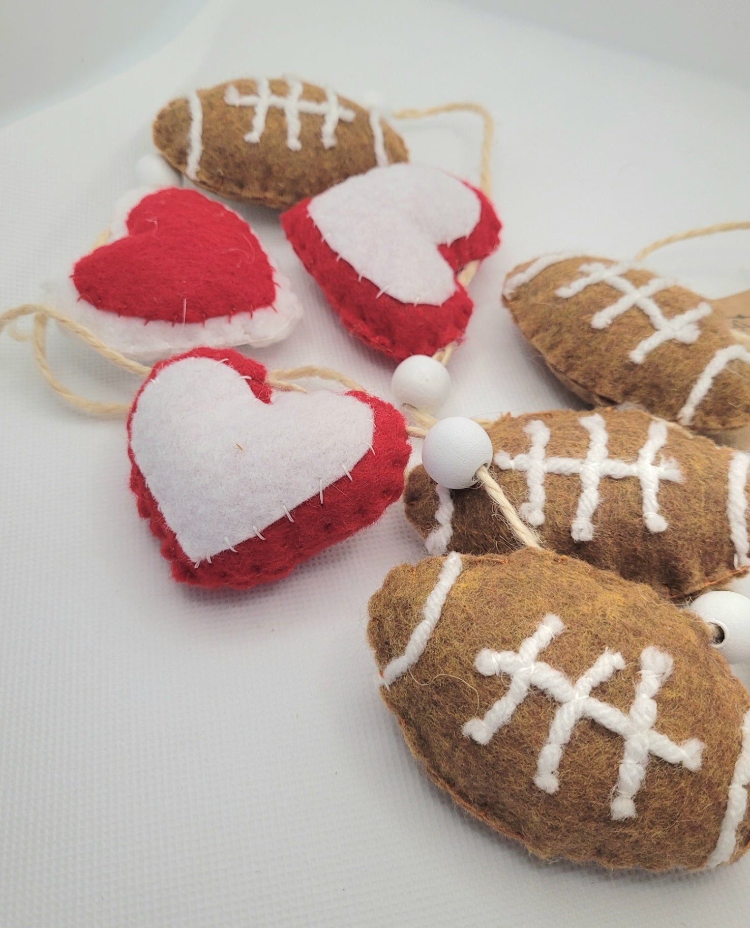 047 - Hand stitched felt garland, Football, Red and White Hearts, Wood beads