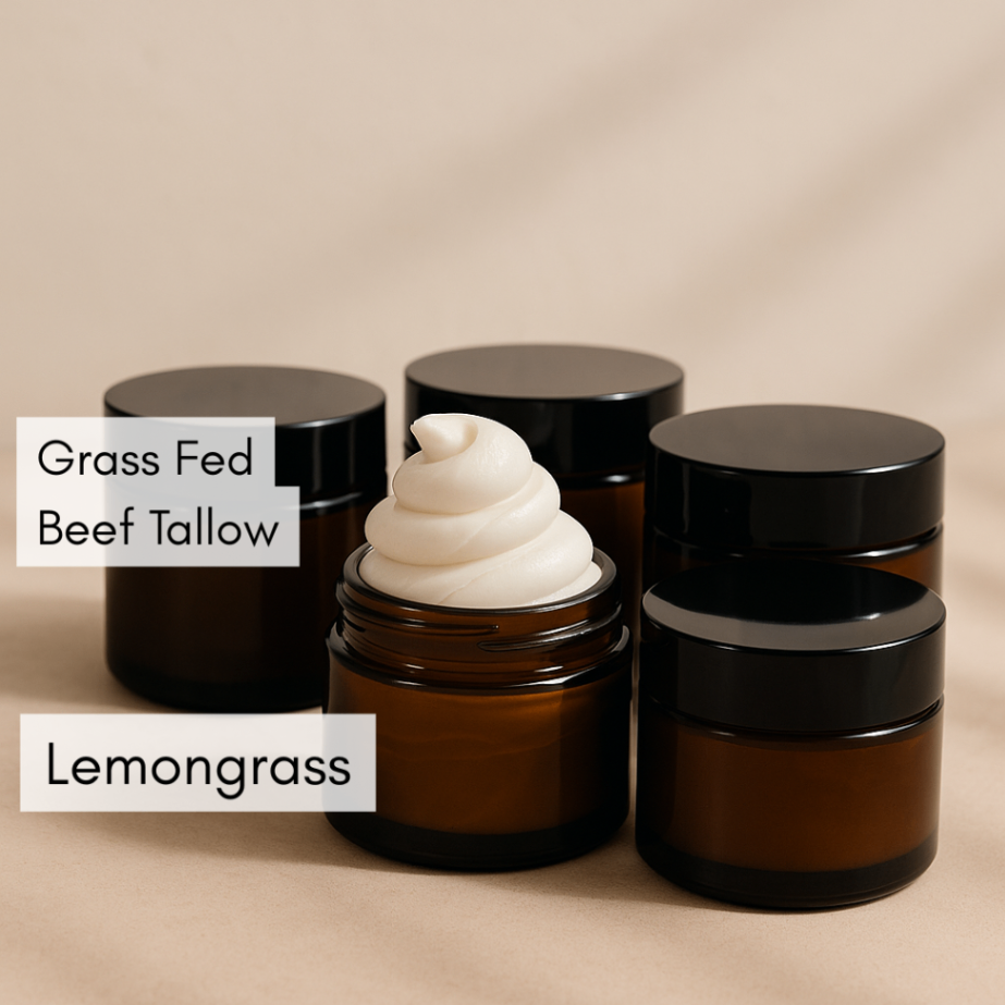 Amber glass skincare jars with black lids on a beige background, with one open jar showing a white cream. Text overlays read 'Grass Fed Beef Tallow' and 'Lemongrass'.