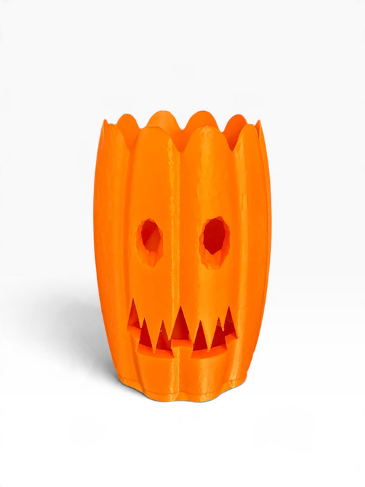 An orange jack-o'-lantern-shaped can holder with a fluted rim and cutout facial features, shown on a clean white background.