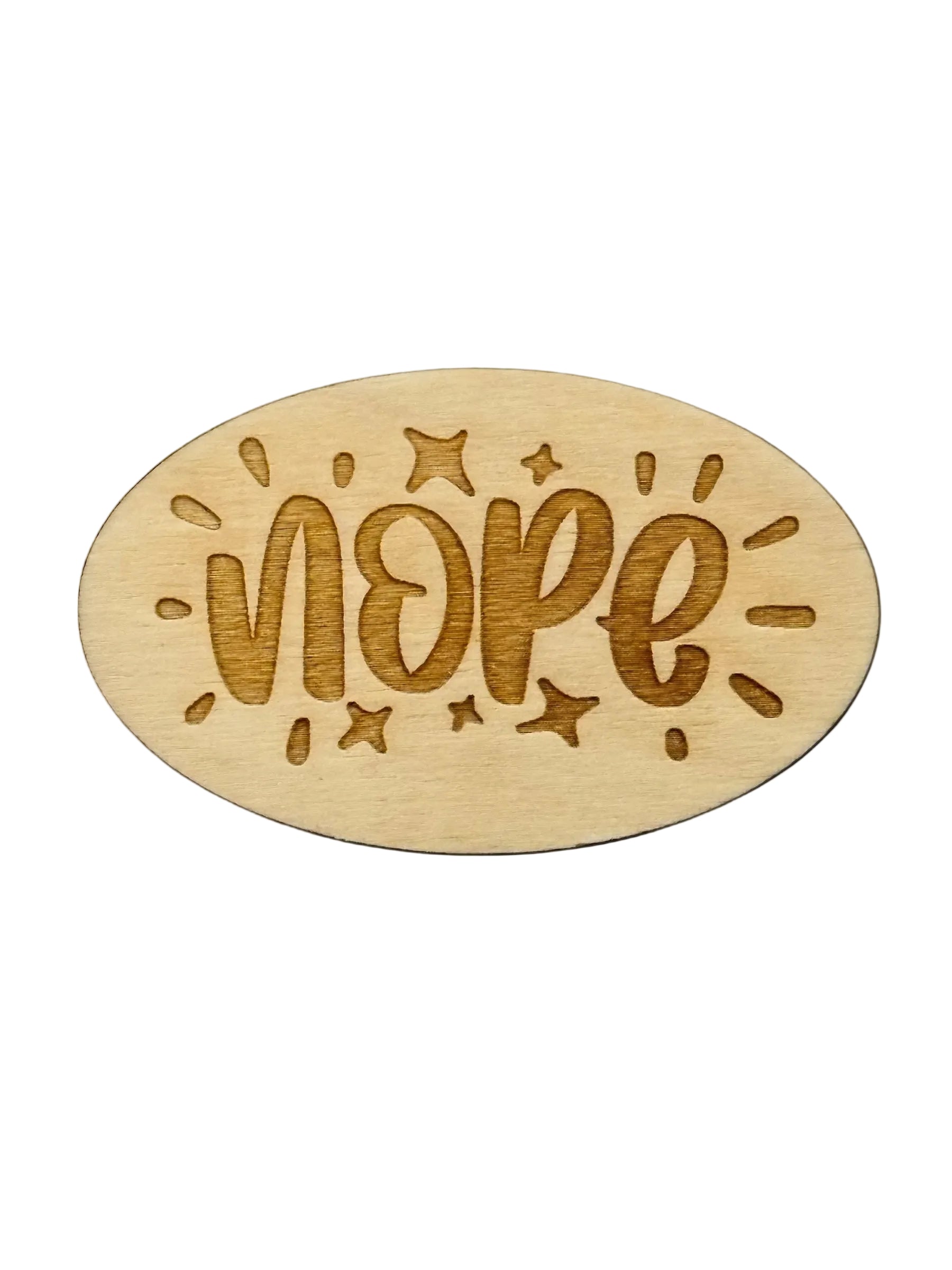 Wooden oval with 'NOPE' engraved on a black background