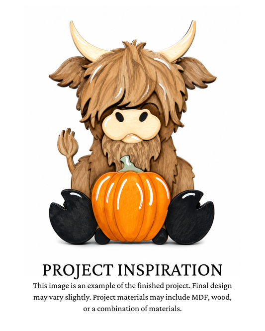Finished project example of a layered Highland cow fall shelf sitter with long shaggy hair, horns and an orange pumpkin. Text below reads “PROJECT INSPIRATION,” describing it as a finished project example.