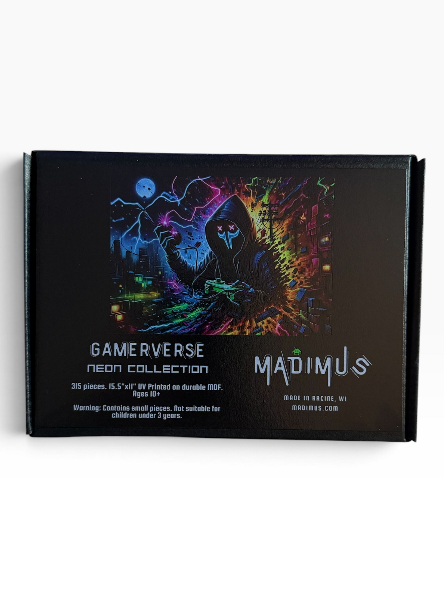 A black rectangular product box for the Madimus Gamerverse Neon puzzle featuring a colorful neon graphic of a hooded figure on a dark background with text detailing the 315 pieces included.
