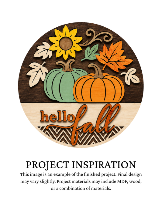 Finished project example of a layered round door sign featuring a bright sunflower, two pumpkins and autumn accents with “Hello Fall” lettering. Text below reads “Project Inspiration.”