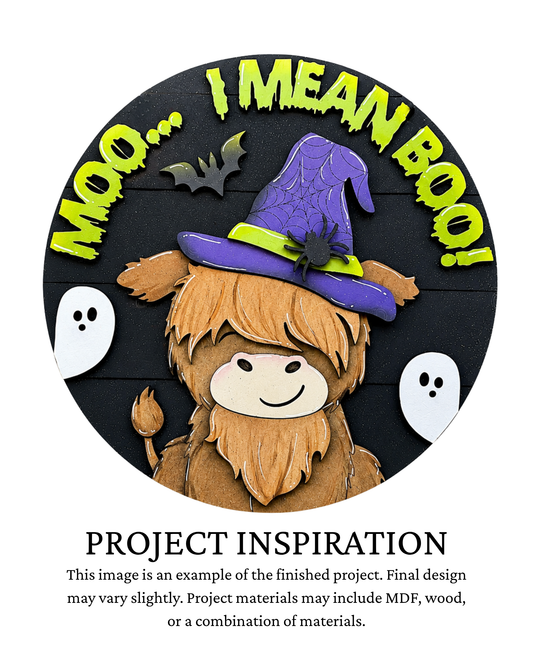 Project inspiration photo for the Moo I Mean Boo Cow DIY round door sign with witch hat, broom and little ghosts.