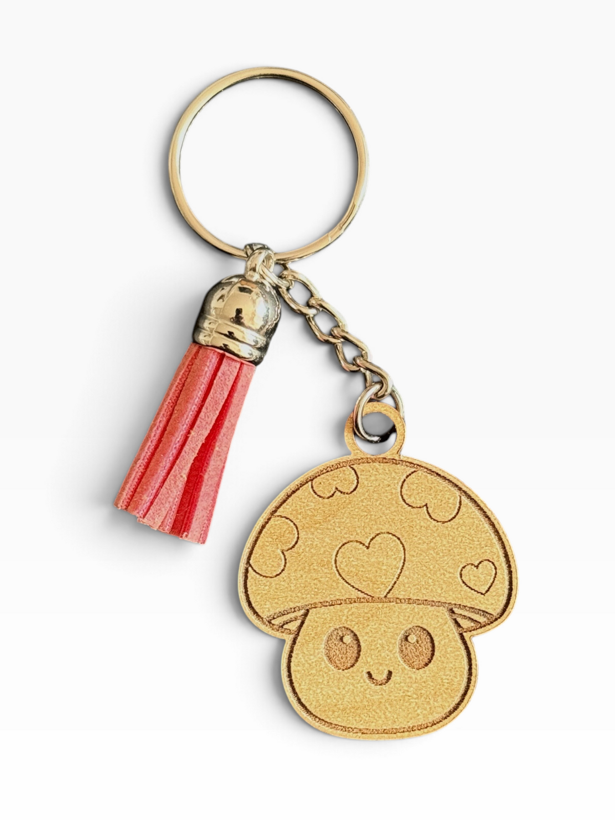Cute laser engraved heart mushroom wood keychain with pink tassel handmade by Maxilyn House in Racine Wisconsin