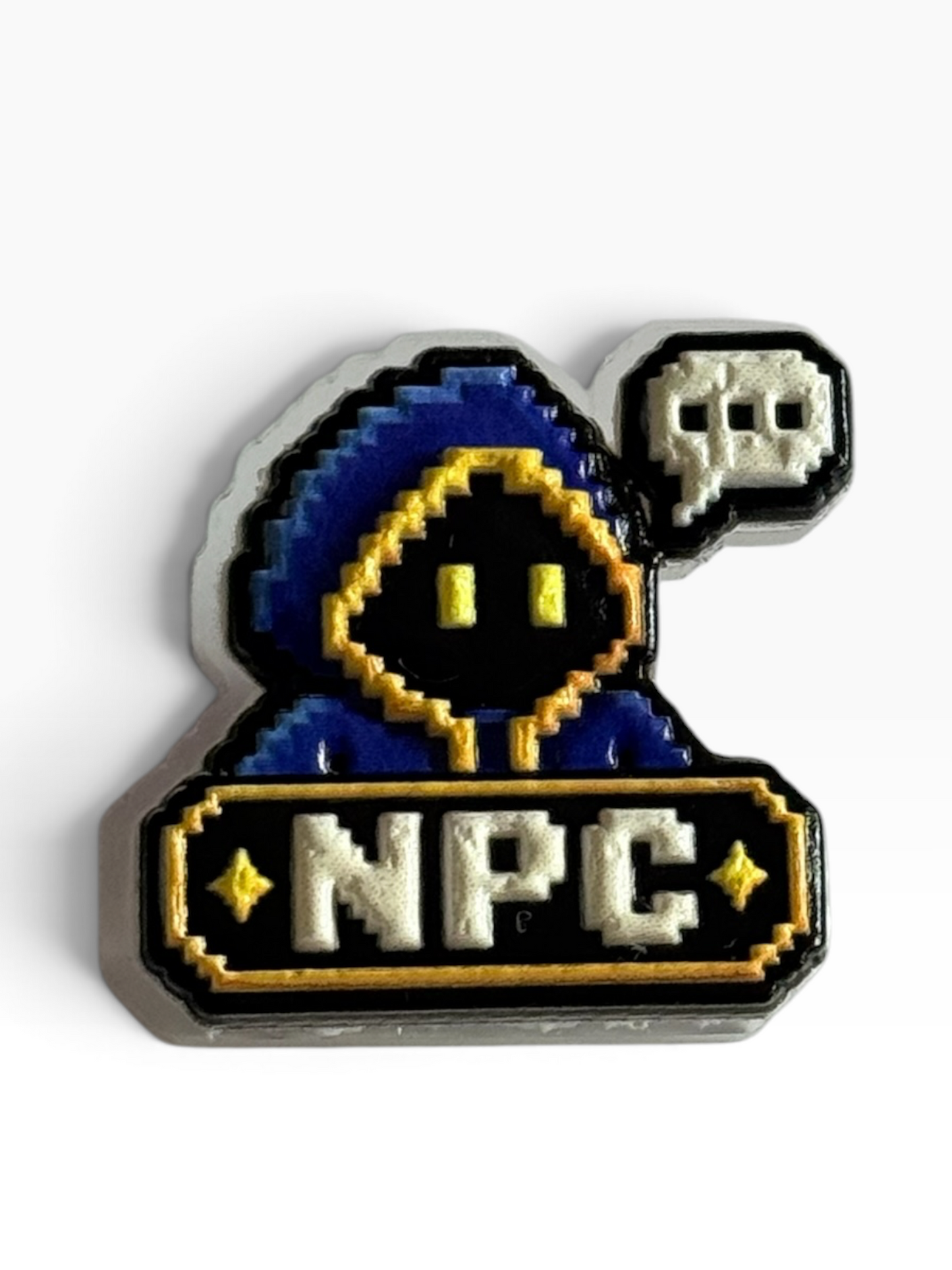 Pixel art acrylic uv printed pin featuring a blue and black hooded character with yellow eyes, a speech bubble with a skull icon, and a banner reading 'NPC' in white with yellow stars, shown on a white background.