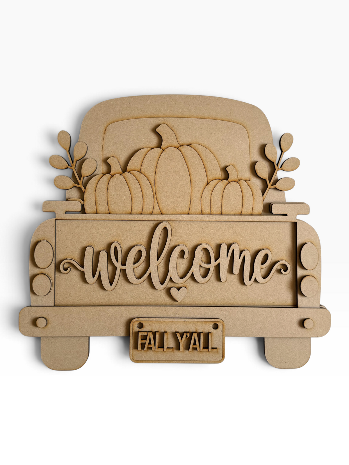 A laser-cut mdf decorative sign shaped like the back of a pickup truck carrying pumpkins, with the word "welcome" in script across the bed and a small license plate reading "FALL Y'all" on a white background.